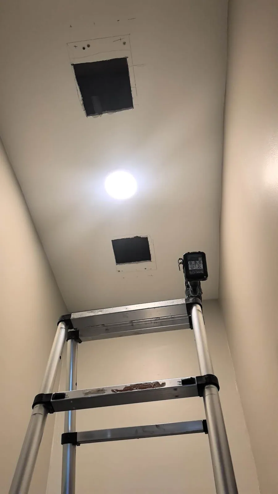 Plaster ceiling opening prepared for drying rack installation