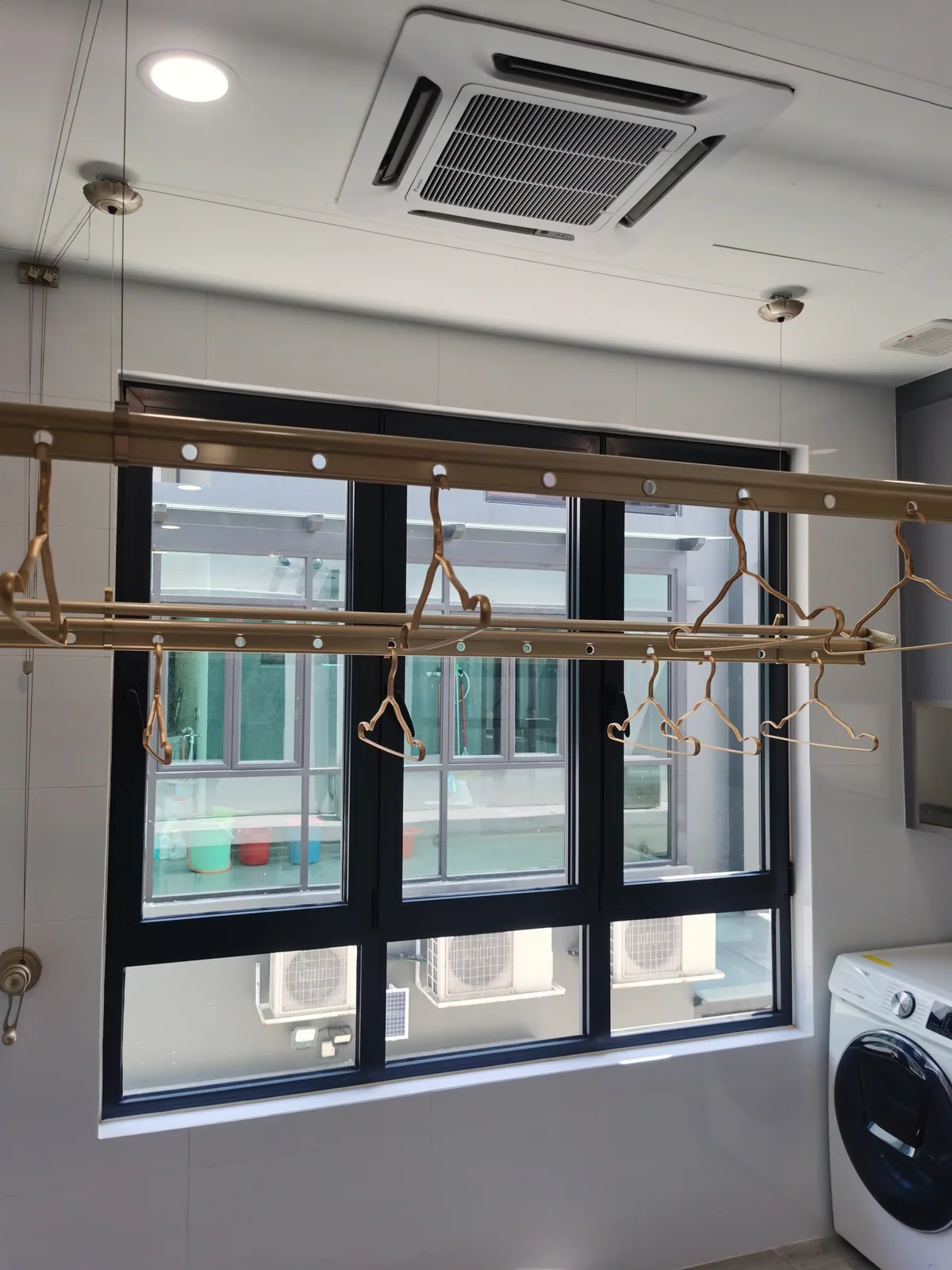 Completed drying rack installation on a plaster ceiling